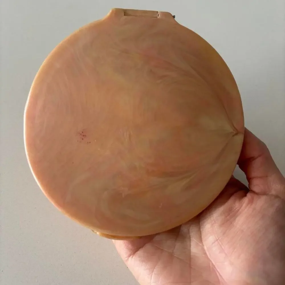 Vintage marbled blush powder compact with carved feather motif